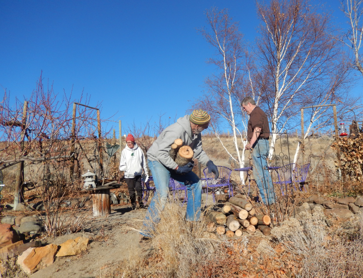 Lynne & Tom Sydner
          preparing wood stack from John